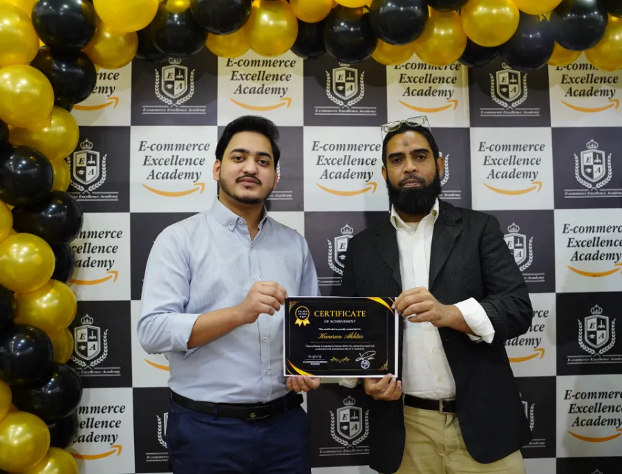 A student receiving his e-commerce course certificate at E-Commerce Excellence Academy, North Nazimabad Karachi