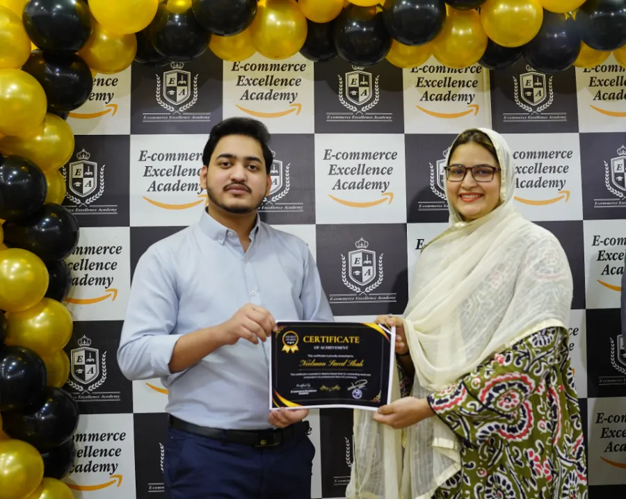 A female student receiving her course certificate at E-Commerce Excellence Academy Karachi